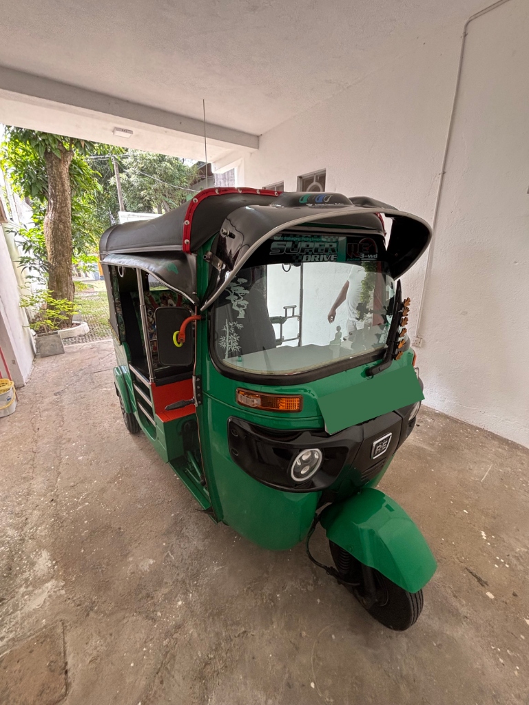 Immaculate front perspective of Maama's custom green tuk tuk